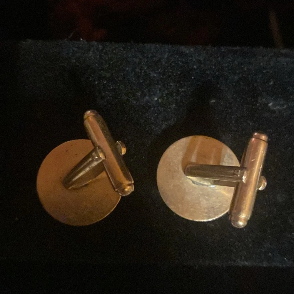 Set of 2 vintage cuff links.  Gold tone/ silver tone. Silver pair are Anson